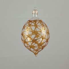 Průhledná skleněná oliva se zlatým třpytivým vzorem pavučiny.