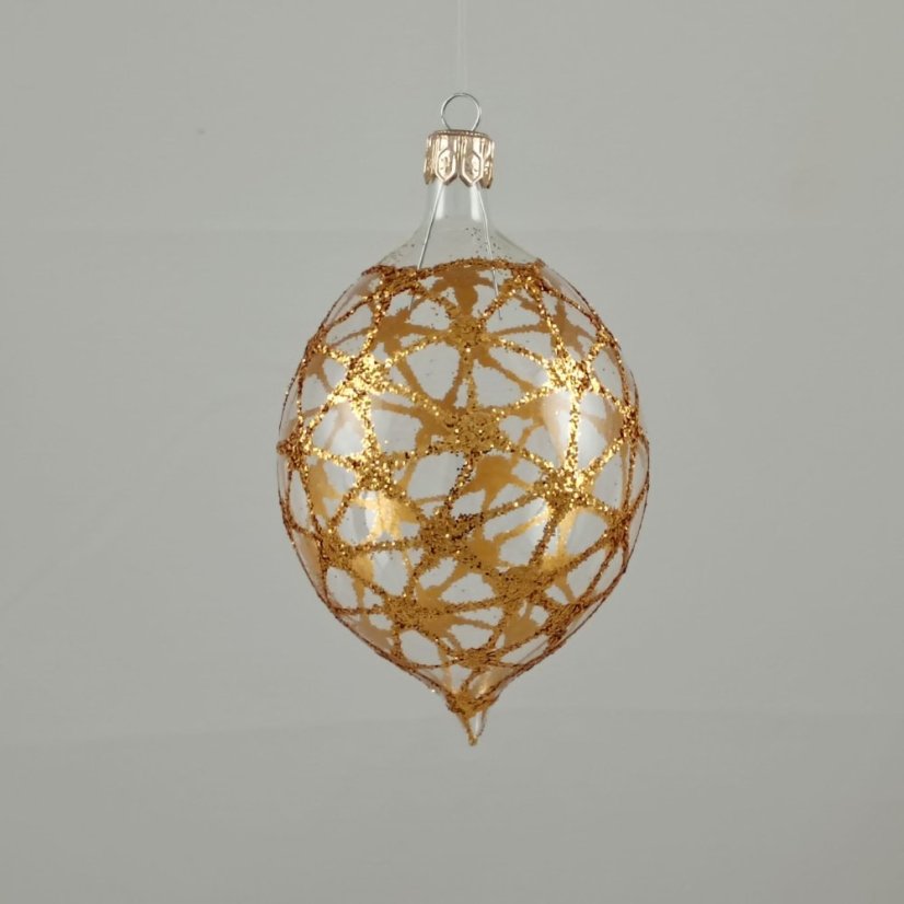Průhledná skleněná oliva se zlatým třpytivým vzorem pavučiny.